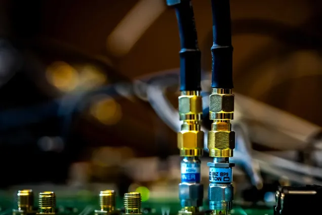 Wires and bolts on a chip. Photo.